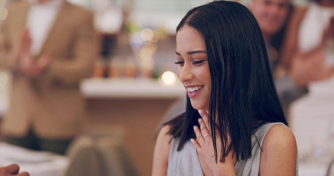 4k video footage of a woman looking surprised while her boyfriend proposes at a restaurant