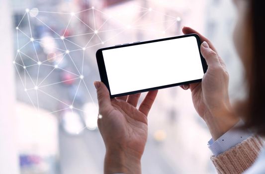 Girl with smartphone with future 5G technology as symbol of global connection and display with copyspace. Gadget with modern wireless network