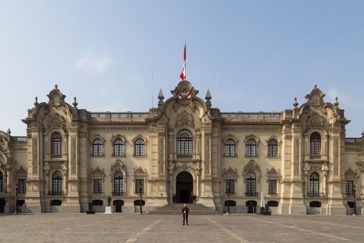 Lima, Peru - September 5, 2015: The Government Palace in the city centre with guards standing in front of it.