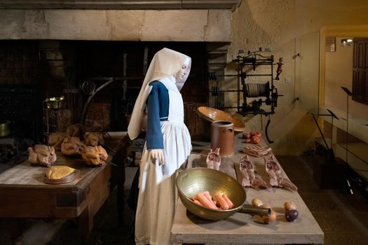 BEAUNE, FRANCE - AUGUST 03,2019. Nun preparing meals for the sick in a Hospices de Beaune.
