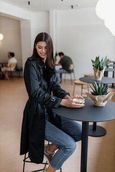 beautiful women in a coffee shop with a cup of coffee.