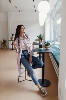 beautiful women in a coffee shop with a cup of coffee.