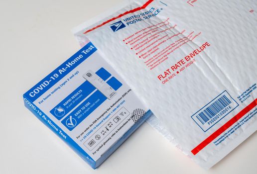 Morgantown, WV - 2 February 2022: Delivery of the federally supplied at-home test for Covid-19 with US Postal service envelope