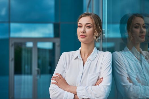 Businesswoman successful woman business person standing arms crossed outdoor corporate building exterior Smile happy caucasian confidence professional business woman middle age female entrepreneur
