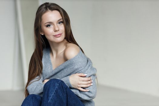 Young beautiful cozy woman indoor. High quality photo