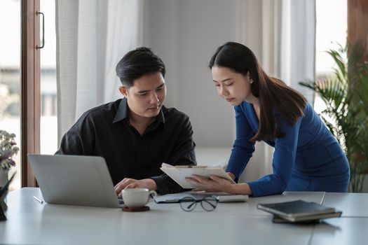 Business People Talking Discussing with coworker planning analyzing financial document data charts and graphs in Meeting and successful teamwork Concept.