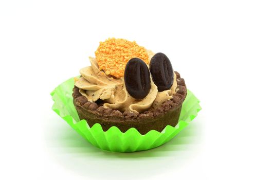 Coffee cupcake in green paper cup placed on a white background.