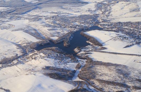 Aerial view of Hlynna Navaria lake in winter