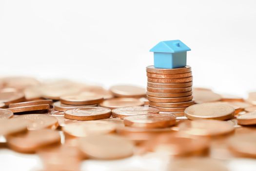 Symbol house mortgage investment property finance real estate profit. Saving money and house investment home buy to let property mortgage euro. Miniature home property money stack coin euro house rent