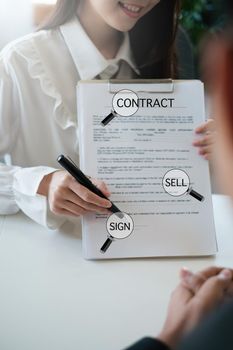 Business woman or broker give contract agreement paper to customer to sign contract. Real Estate and Agreement concept
