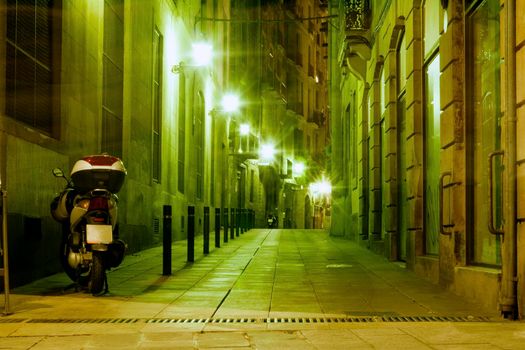 illuminated Barcelona night street in famous Gothic Quarter district