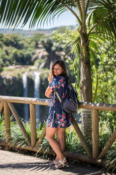 Woman on the background of the waterfall of Chamarel Mauritius