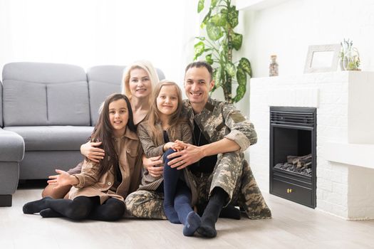 Joyful happy military man with his wife and two kids. Family togetherness and support concept.