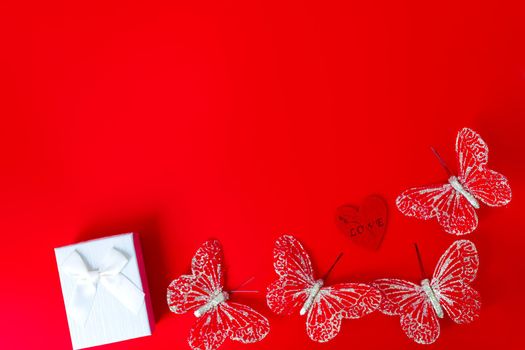 Gift box on red background. Romantic st. Valentine's day concept of greetings. place for your text.