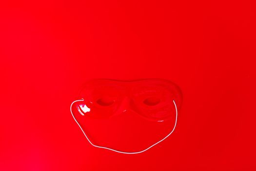 carnival mask on red background