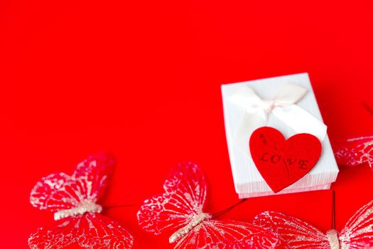 Gift box on red background. Romantic st. Valentine's day concept of greetings. place for your text.