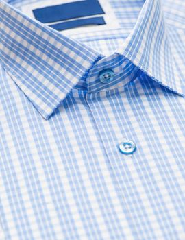 blue shirt with checkered pattern and with a focus on the collar and button, close-up