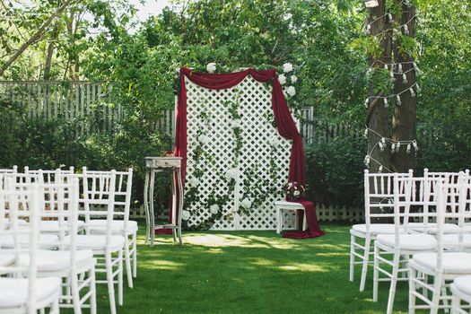 Beautiful wedding ceremony in the park on the grass