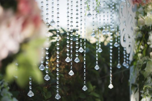 beautiful wedding ceremony in the park. crystal drops