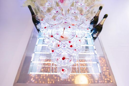 Pyramid of glasses, cherry in the glass