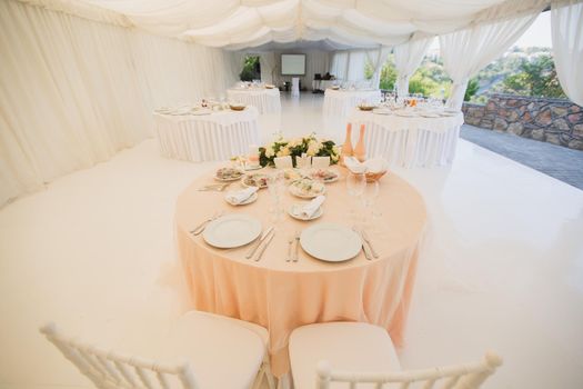 Beautiful Banquet hall under a tent for a wedding reception.