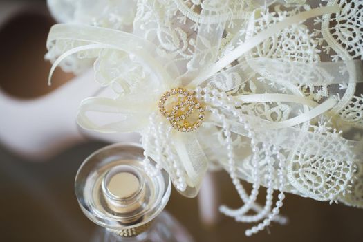 The bride's garter on her leg is a close-up.