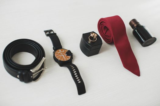 Men's accessories: belt, watch tie and rings