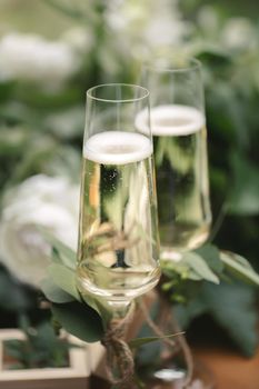 Wedding glasses with champagne on the table