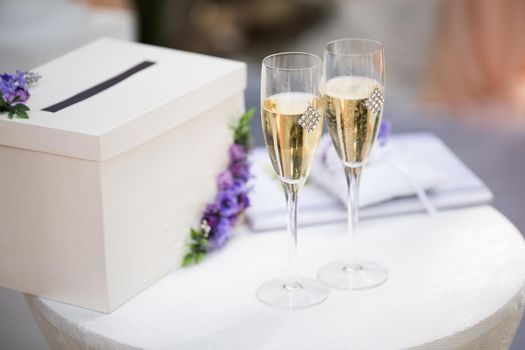 Wedding glasses with champagne on the table