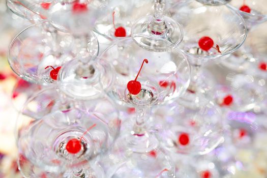 Pyramid of glasses, cherry in the glass