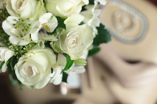 Delicate wedding bouquet of white flowers close-up.