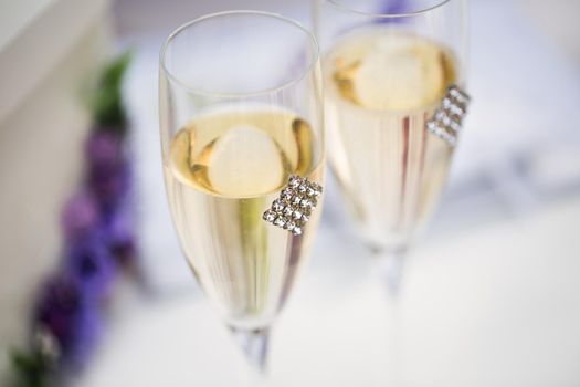 Wedding glasses with champagne on the table