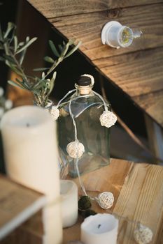 Wedding decor made of candles, wooden boxes and gypsophila
