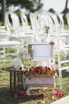 A box with rose petals for a wedding ceremony.