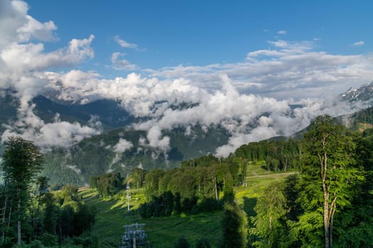 Caucasus mountains with trees and a clouds, Russia