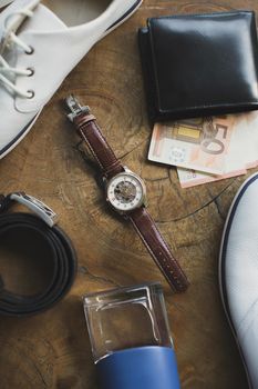 Accessories for men on a wooden table.