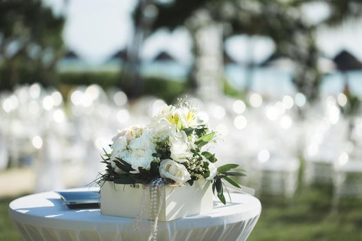 A composition of fresh flowers on the table for the wedding registration.