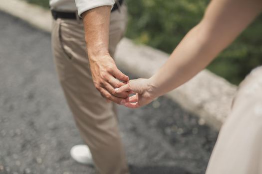 groom keeps a bride hand and walkinggroom keeps a bride hand and walking