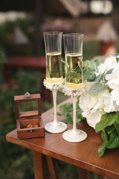 Bride and groom champagne glasses at a wedding reception.