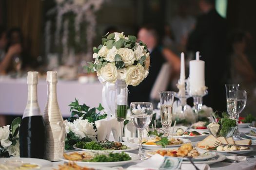 Served wedding banquet table with dishes in the restaurant