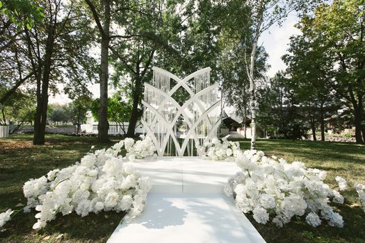 A beautiful arch for an outdoor wedding ceremony.