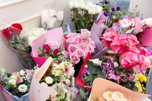 Vases with bouquets of flowers. storage of donated flowers at a banquet in a restaurant.