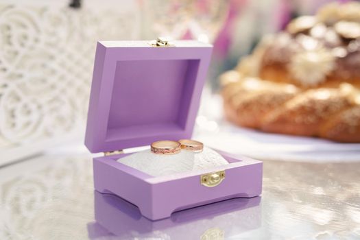 Wedding rings in a beautiful box before the ceremony. Details of the wedding day.