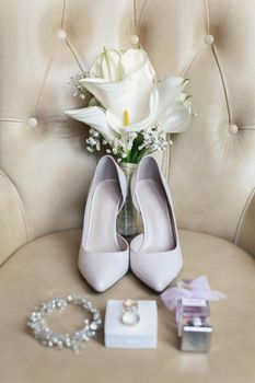 Elegant wedding accessories of the bride in the morning on the day of the celebration.