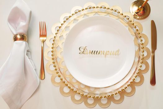 Luxurious setting of a festive table in a golden style.