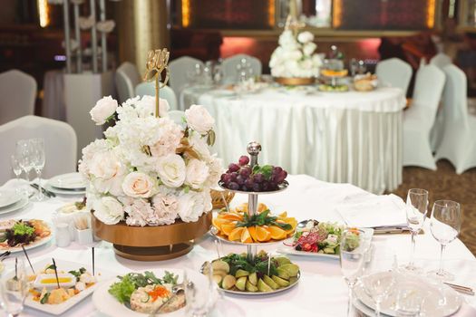 Served wedding banquet table with dishes in the restaurant