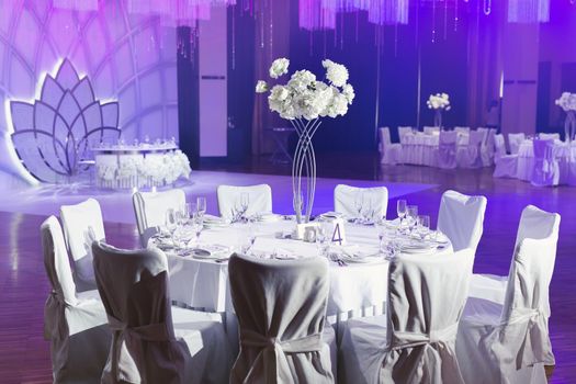 Elegant wedding banquet decoration and table setting in the restaurant.