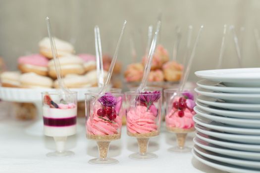 Buffet and candy bar at a wedding in a restaurant.