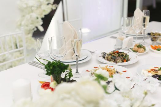 Served wedding banquet table with dishes in the restaurant