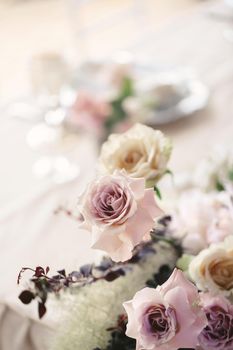 Colorful wedding bouquet on a restaurant served table.